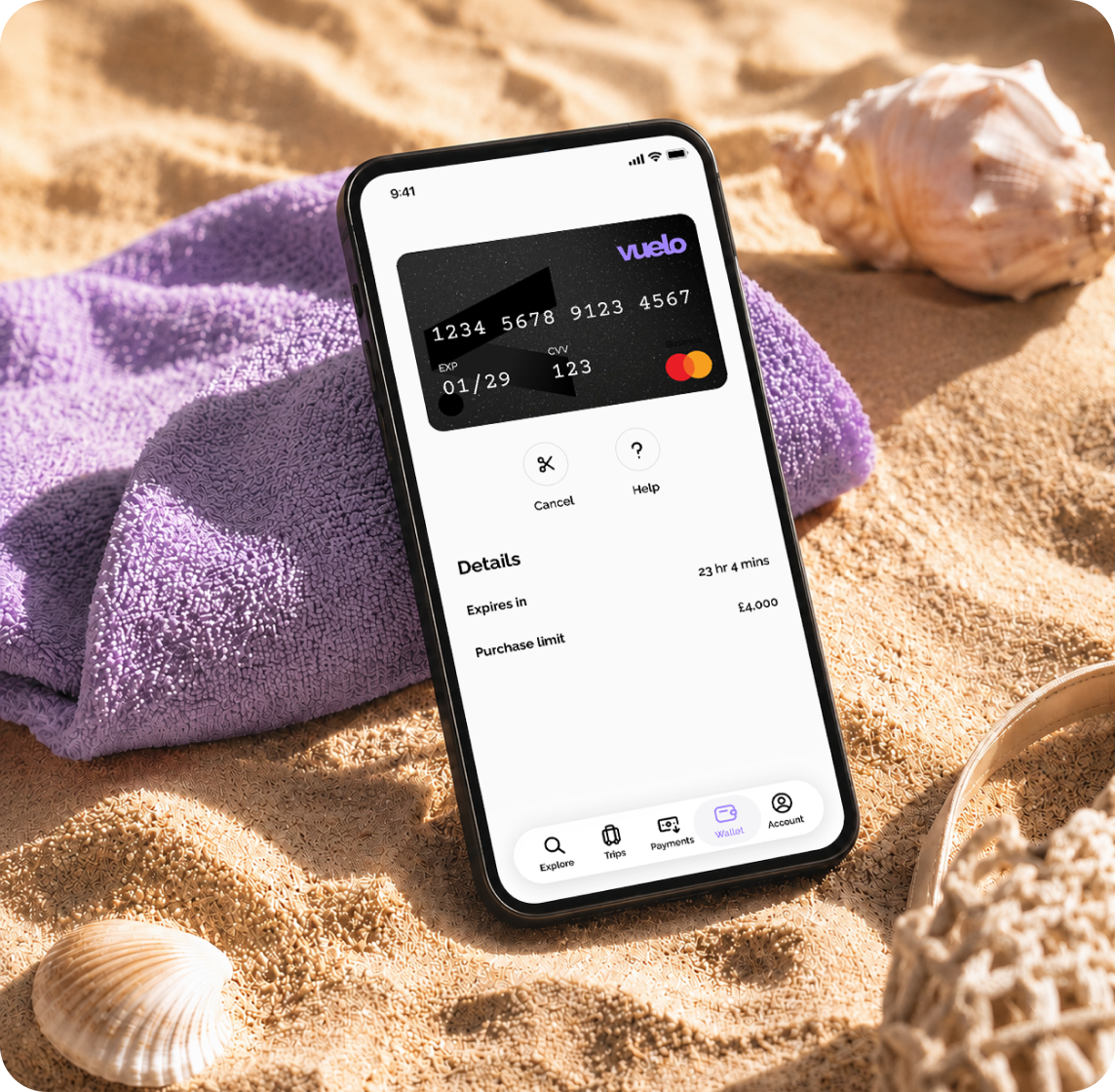 Phone on a beach towel showing the Vuelo One-Time Card details in the app