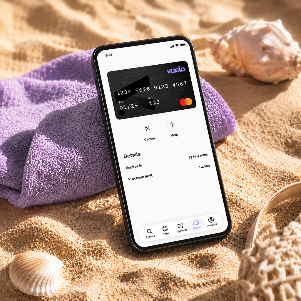 Phone on a beach towel showing a Vuelo One-time Card