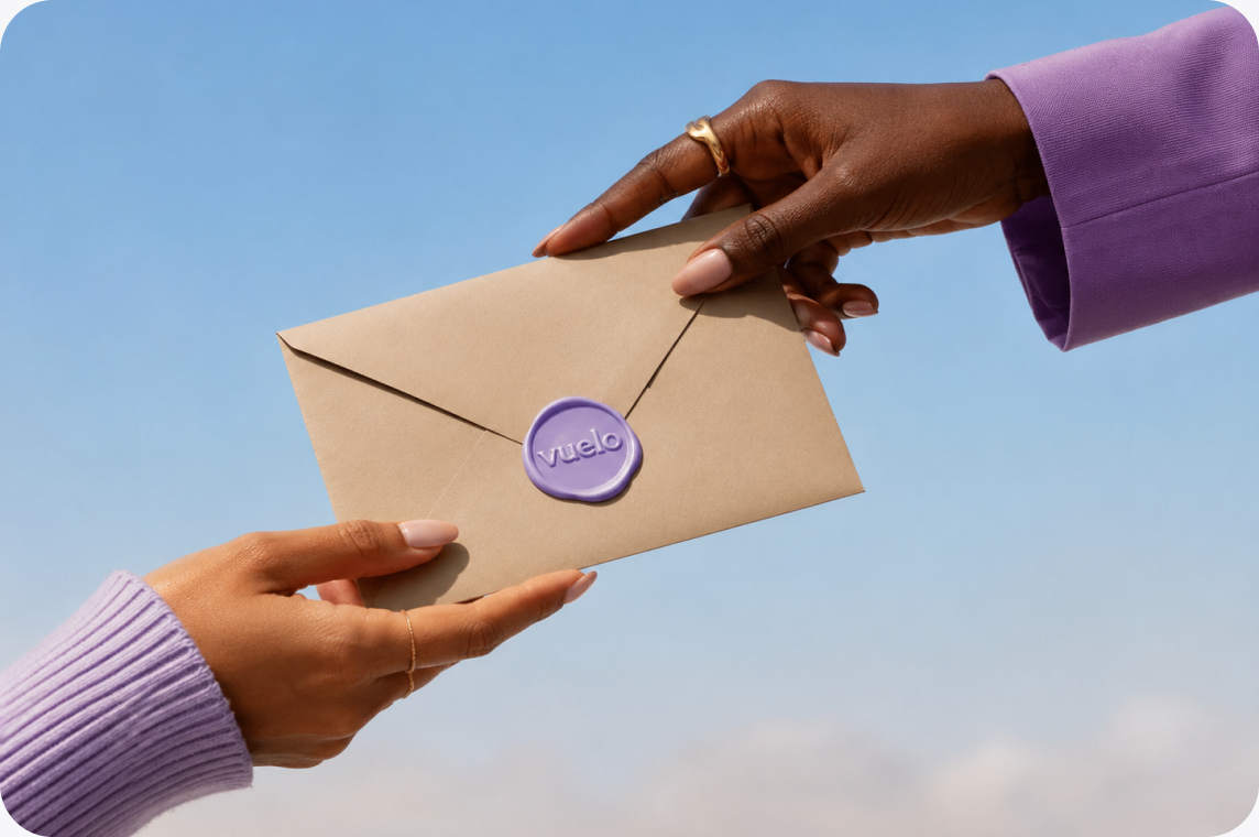 Two hands passing a wax-sealed envelope with the Vuelo logo